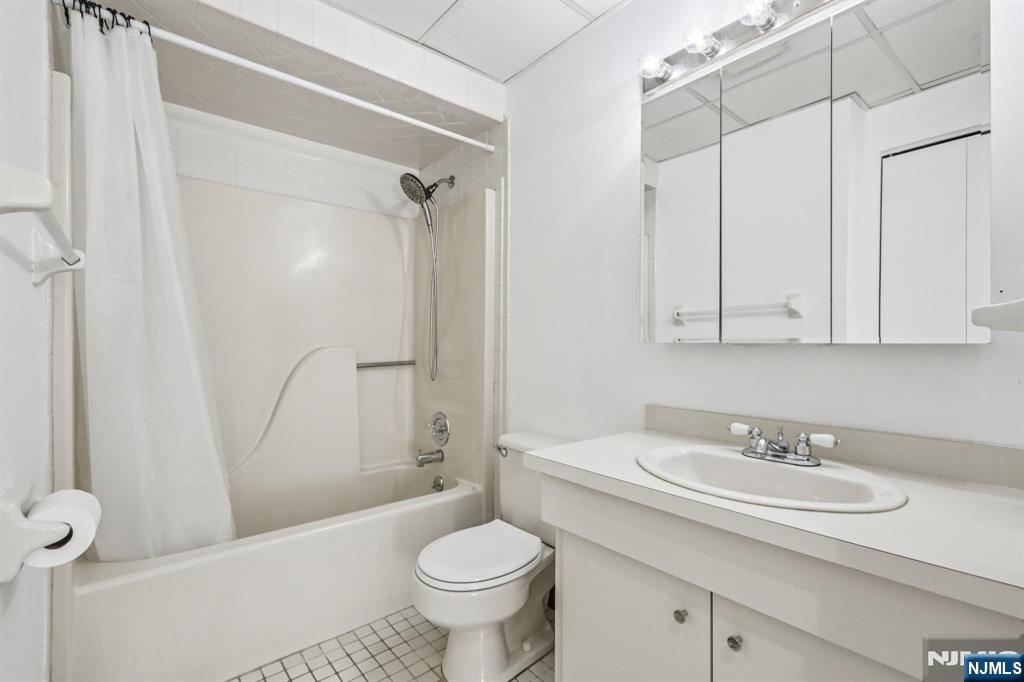 279 Clark Street, Unit A7 Hackensack, NJ 07601 - Photo 22 of 34 a bathroom with a sink toilet and shower