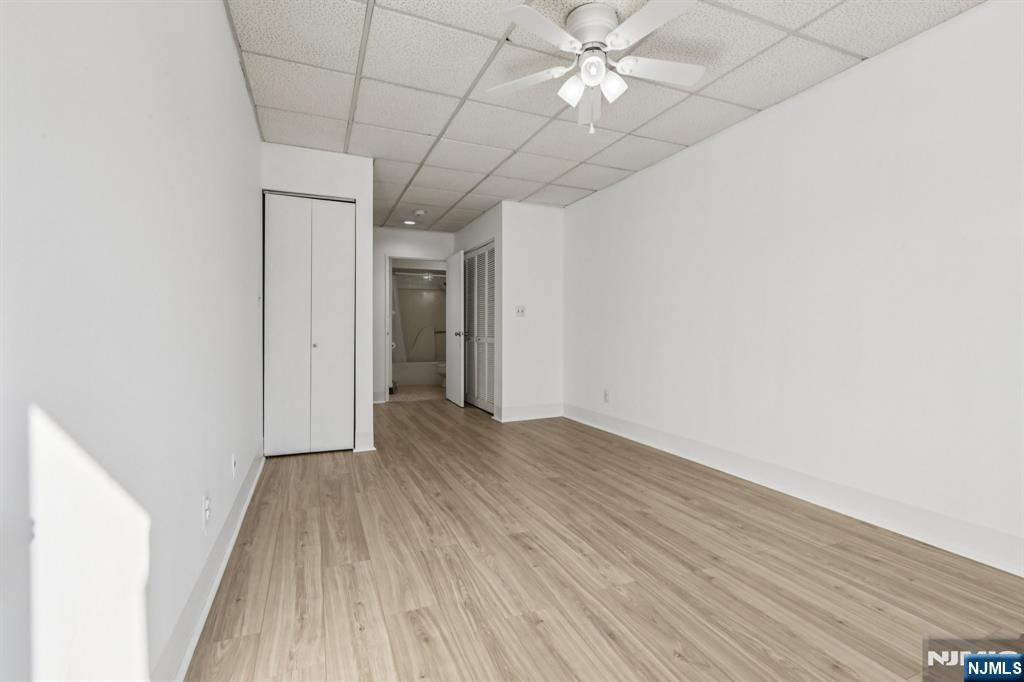 279 Clark Street, Unit A7 Hackensack, NJ 07601 - Photo 25 of 34 wooden floor in an empty room