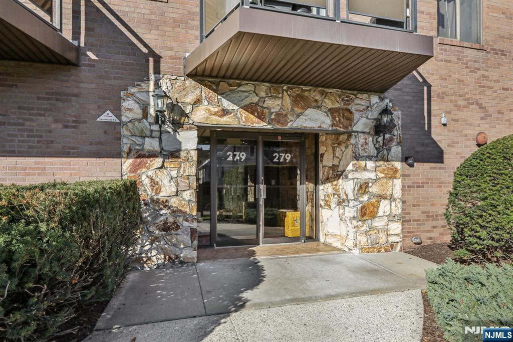 279 Clark Street, Unit A7 Hackensack, NJ 07601 - Photo 3 of 34 a view of a chairs and table in the patio