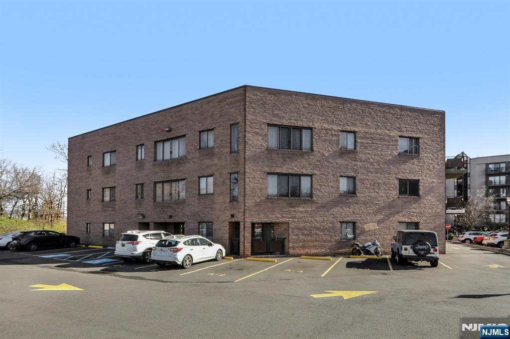 279 Clark Street, Unit A7 Hackensack, NJ 07601 - Photo 33 of 34 a car parked in front of a building
