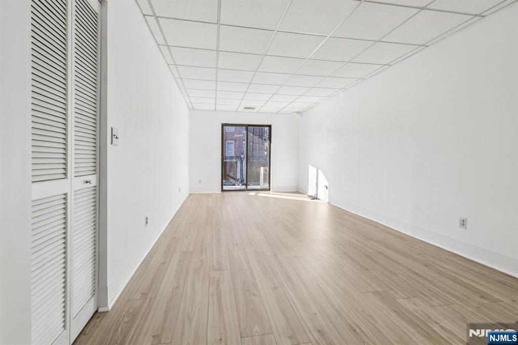 279 Clark Street, Unit A7 Hackensack, NJ 07601 - Photo 8 of 34 a view of livingroom with wooden floor