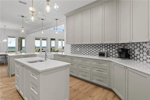 a kitchen with a sink cabinets and window