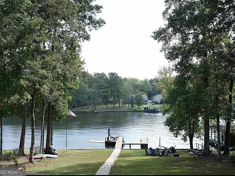 135 Southshore Road Eatonton, GA 31024 - Photo 11 of 13 a view of a lake with houses