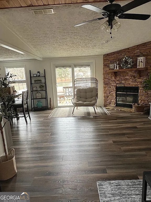 135 Southshore Road Eatonton, GA 31024 - Photo 3 of 13 a living room with furniture wooden floor and a fireplace