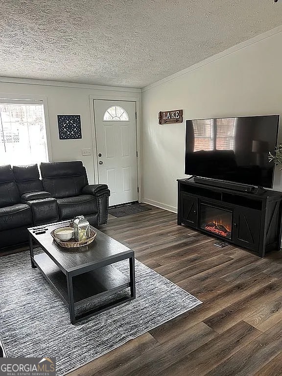 135 Southshore Road Eatonton, GA 31024 - Photo 4 of 13 a living room with furniture and a flat screen tv