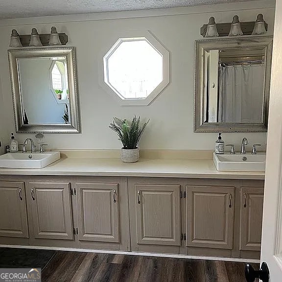 135 Southshore Road Eatonton, GA 31024 - Photo 8 of 13 a bathroom with a double vanity sink and a mirror