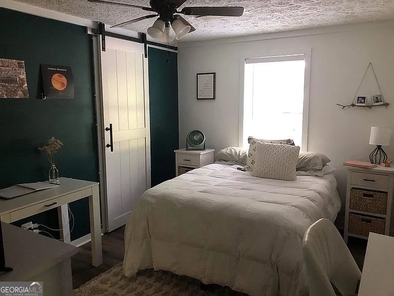 135 Southshore Road Eatonton, GA 31024 - Photo 9 of 13 a bedroom with a bed and a table