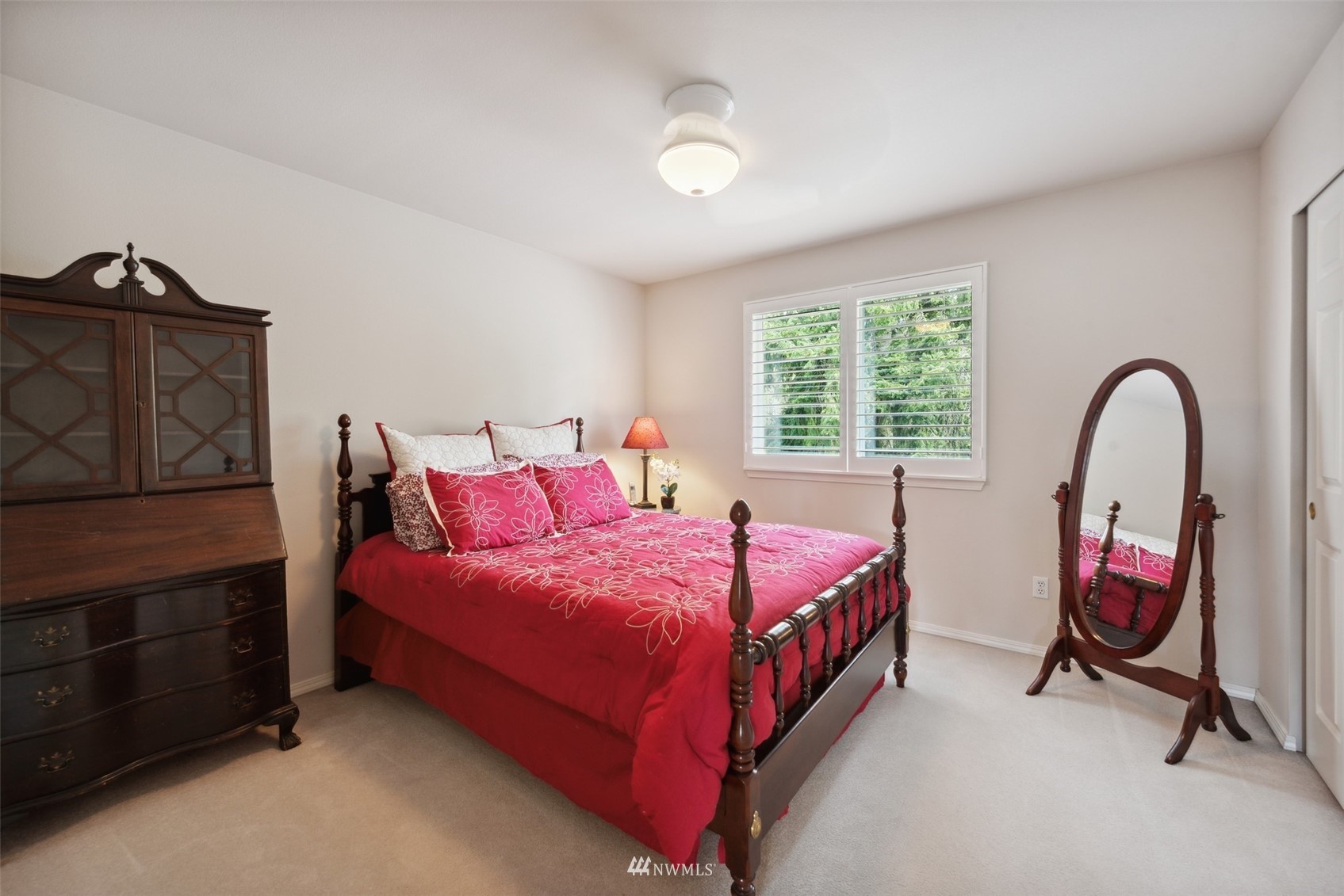 562 Chelan Place Northeast Renton, WA 98059 - Photo 16 of 27 a bedroom with a bed a dresser and next to a window