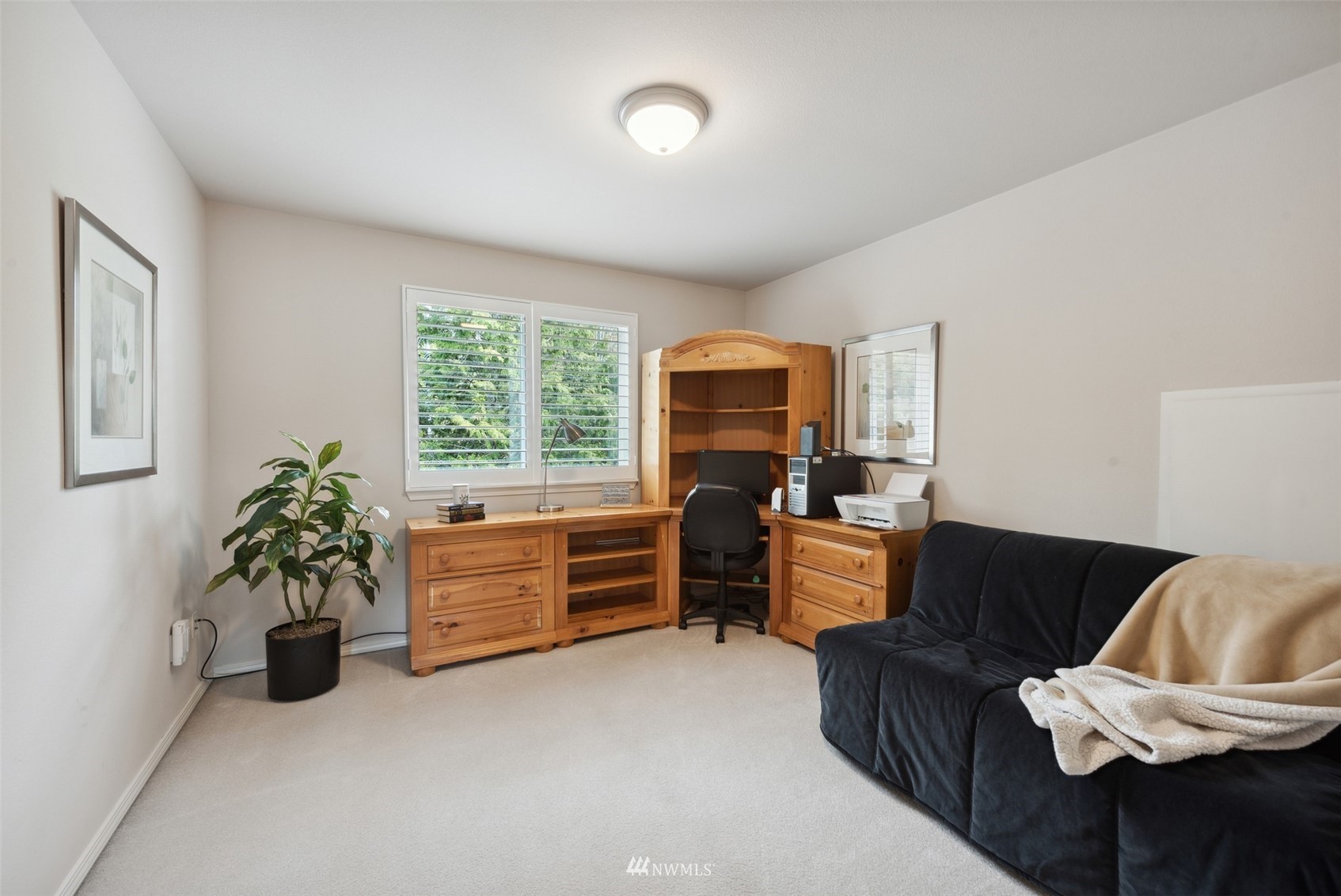 562 Chelan Place Northeast Renton, WA 98059 - Photo 17 of 27 a bedroom with furniture and a bed