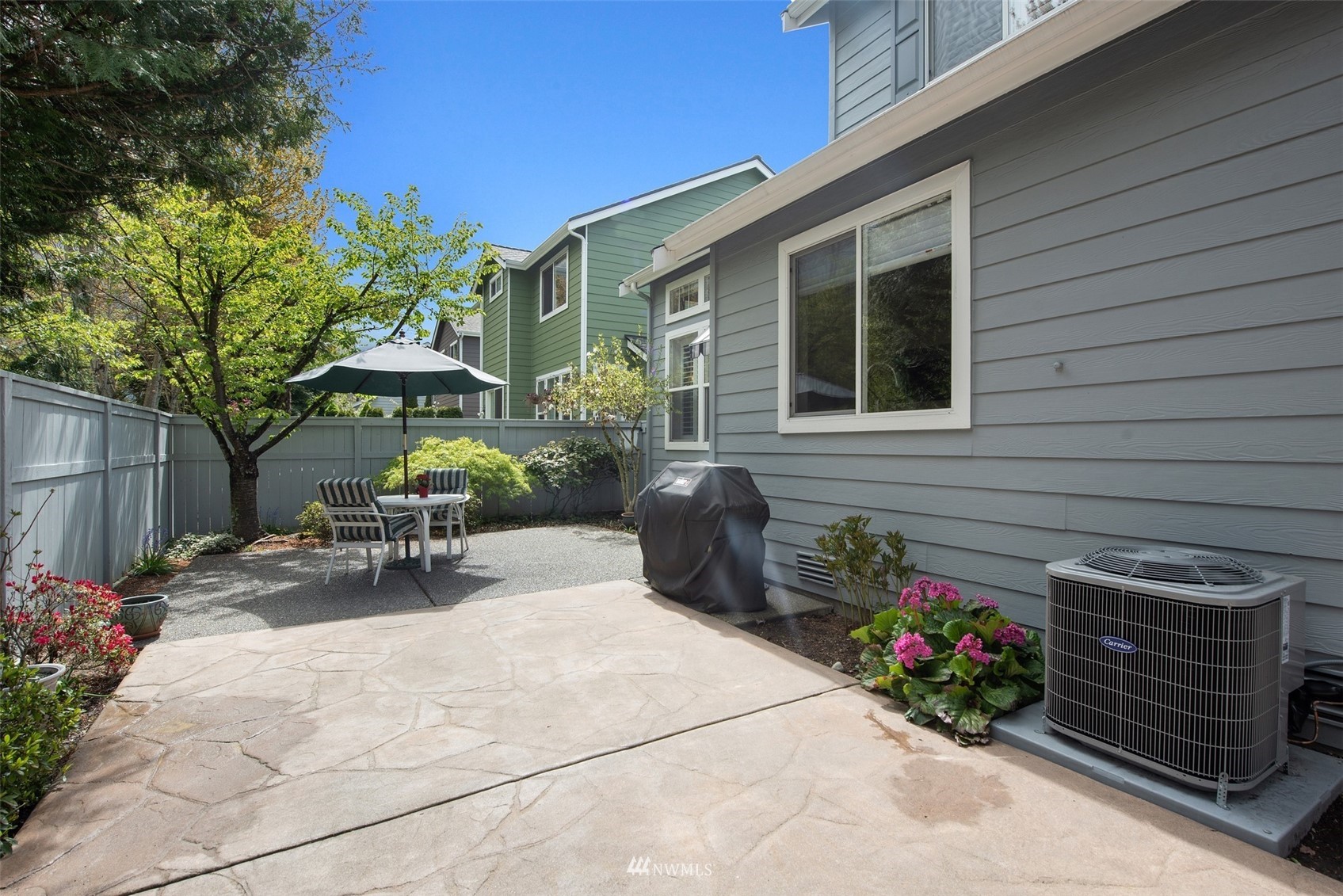 562 Chelan Place Northeast Renton, WA 98059 - Photo 22 of 27 a view of a chair and table in backyard of the house