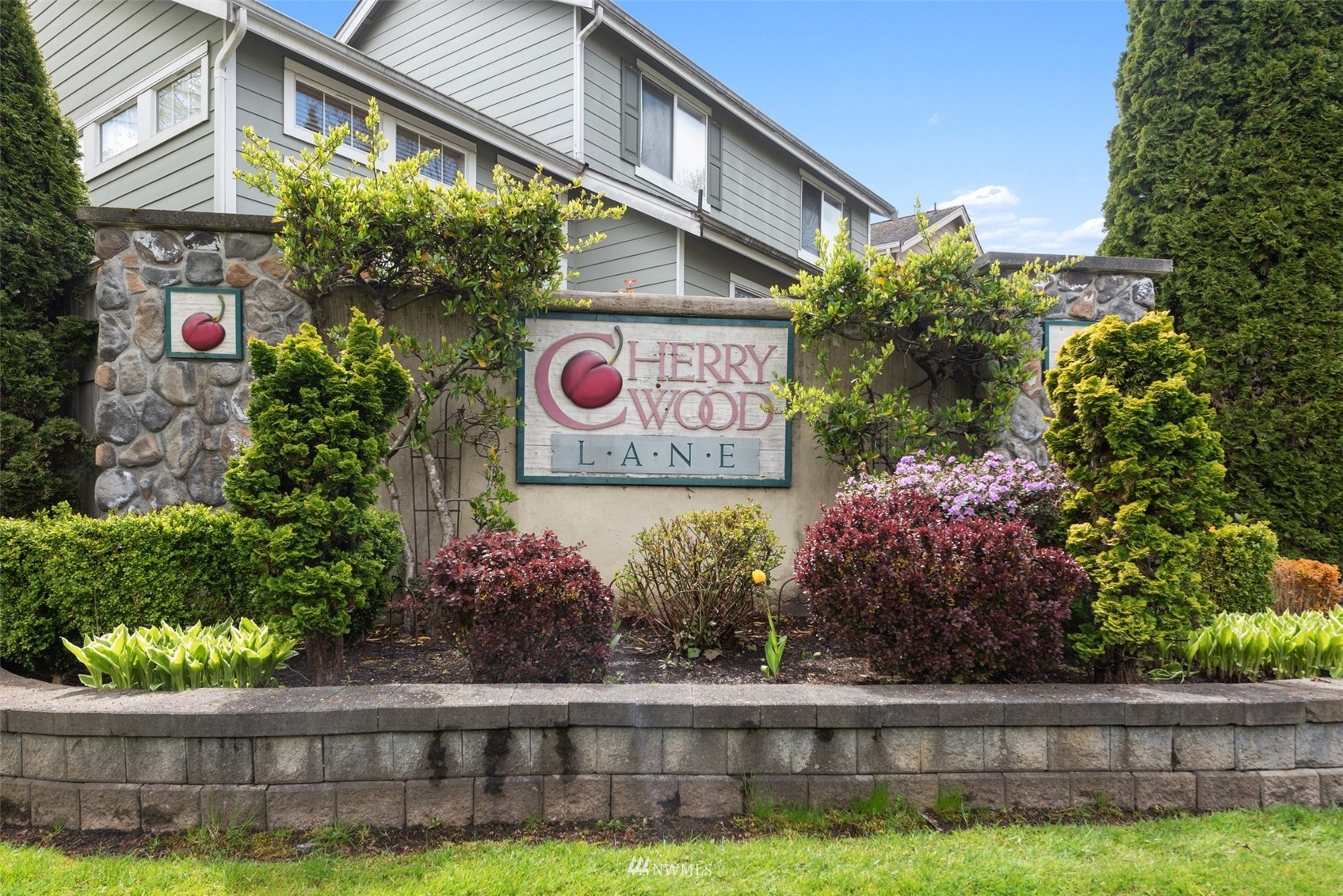 562 Chelan Place Northeast Renton, WA 98059 - Photo 25 of 27 a sign that is on the side of a brick building