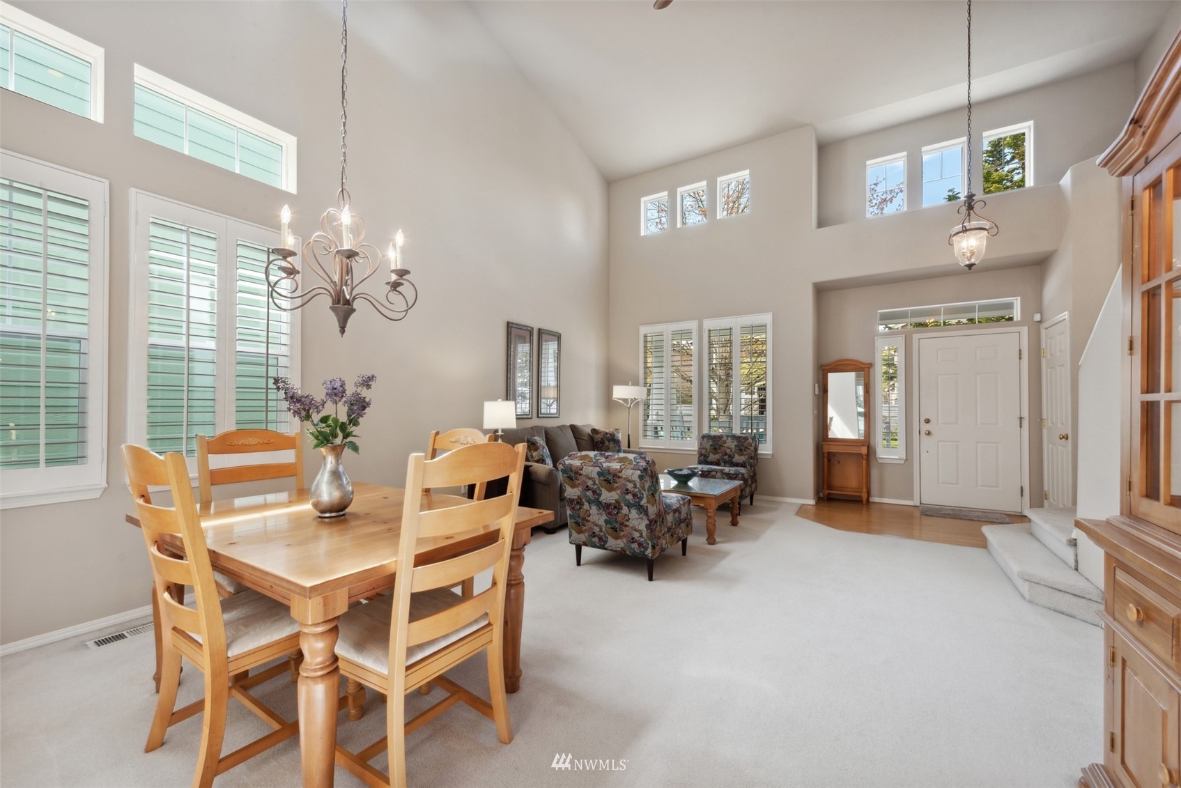 562 Chelan Place Northeast Renton, WA 98059 - Photo 9 of 27 a dining room with furniture a livingroom and chandelier