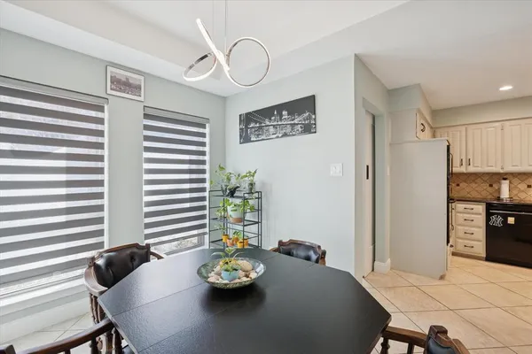 a view of a dining room with furniture and a window