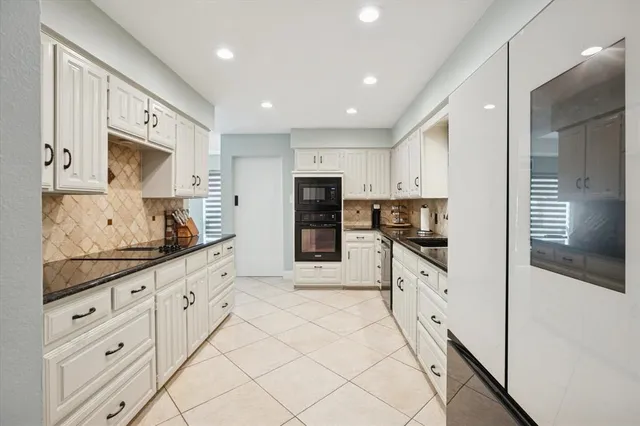 a large kitchen with cabinets