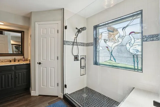 a view of kitchen with wooden floor and window