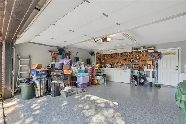 a view of a room with lots of wooden furniture