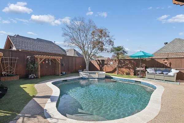 a view of a backyard with swimming pool
