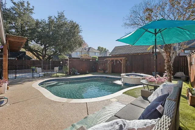 a view of pool with an outdoor seating
