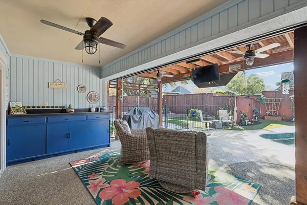 a living room with patio furniture