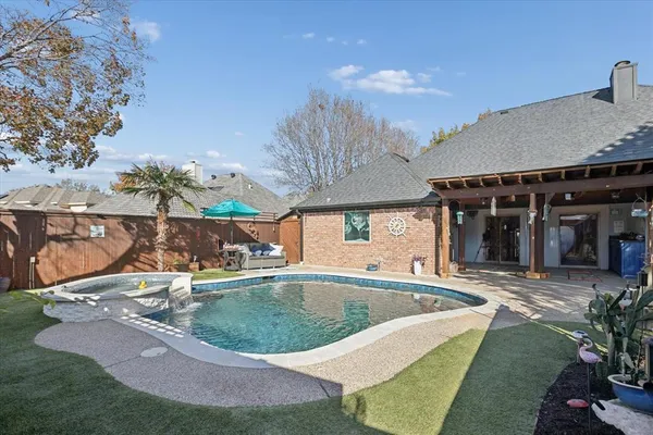 a view of a swimming pool with a patio
