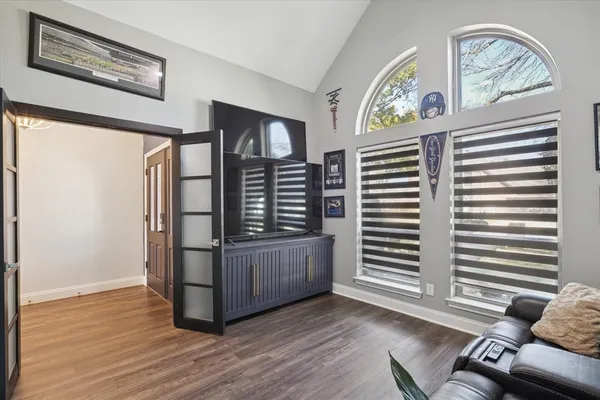 a view of an entryway with wooden floor