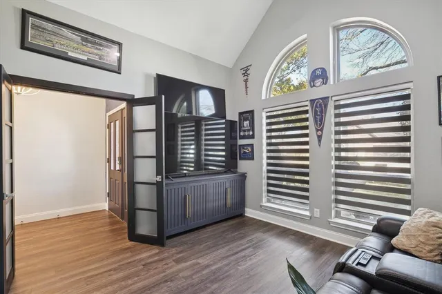 a view of an entryway with wooden floor