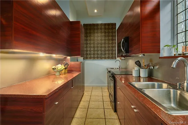 a kitchen with a sink and cabinets