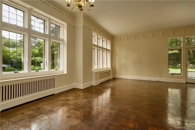 a view of an empty room with glass windows