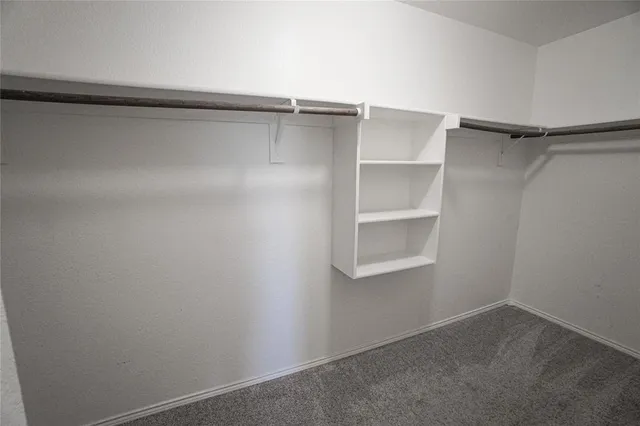 a view of an empty walk in closet