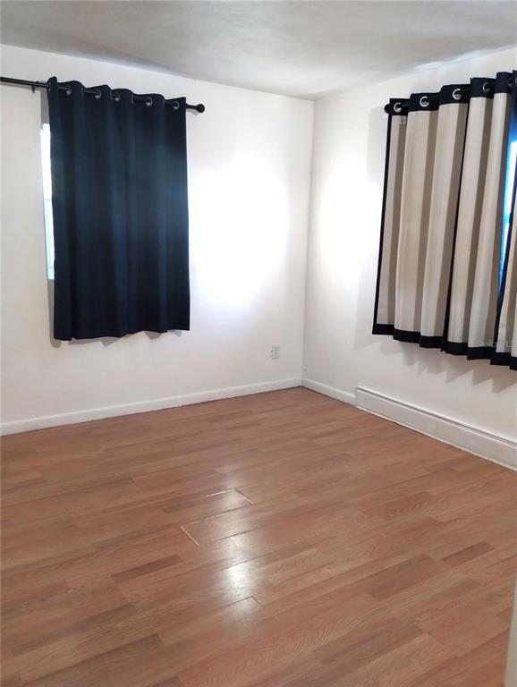 417 East Main Street Dundee, FL 33838 - Photo 12 of 24 a view of an empty room with wooden floor