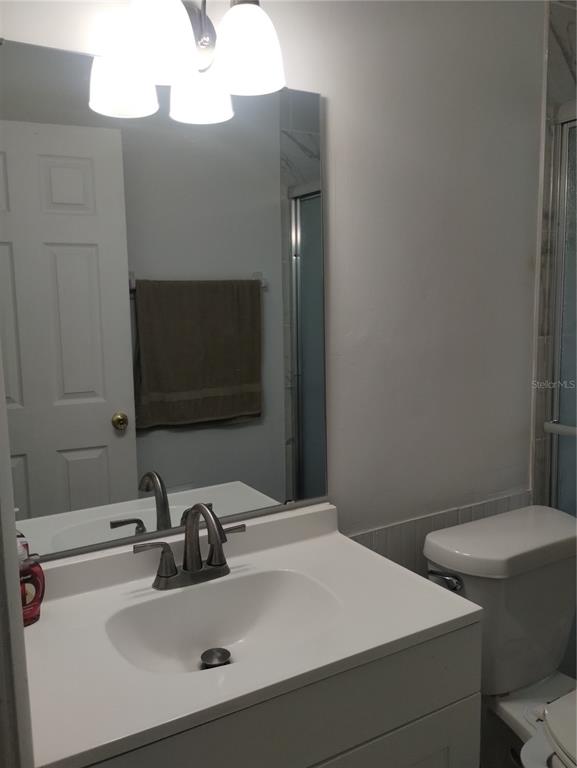 417 East Main Street Dundee, FL 33838 - Photo 13 of 24 a bathroom with a sink and a toilet