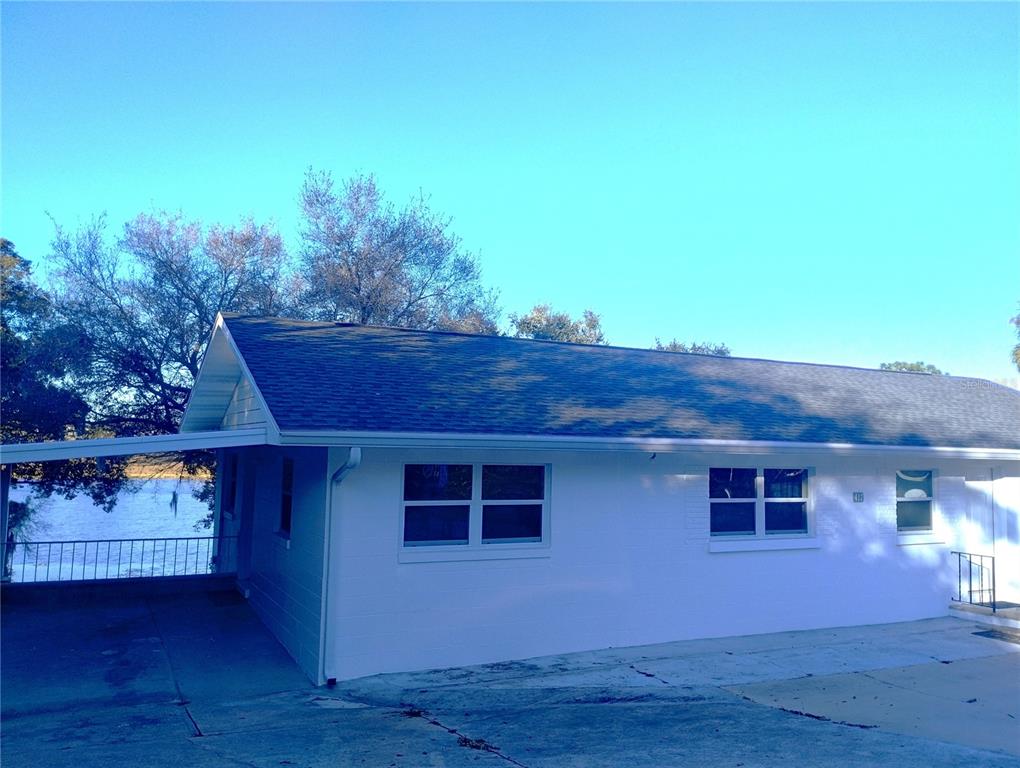 417 East Main Street Dundee, FL 33838 - Photo 3 of 24 a front view of a house with a yard