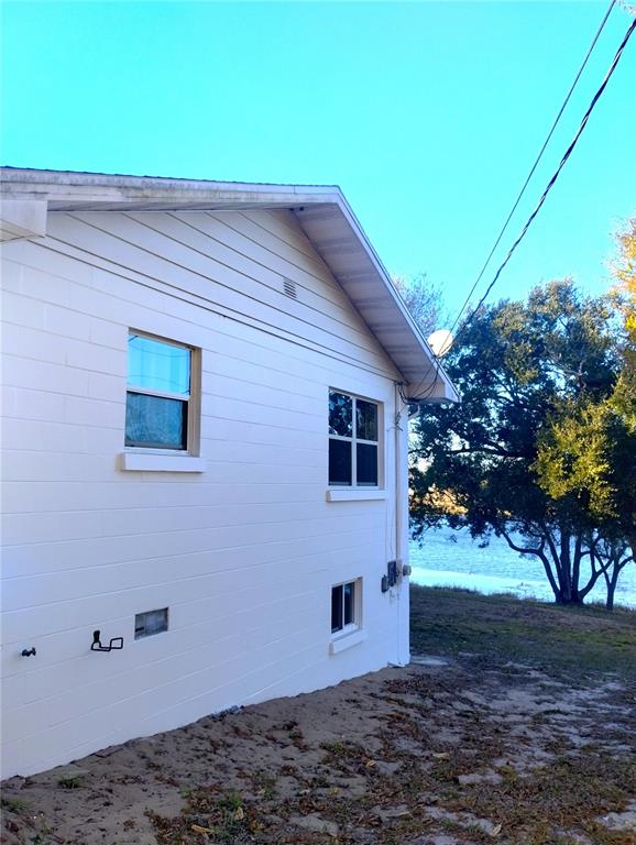 417 East Main Street Dundee, FL 33838 - Photo 5 of 24 a backyard of a house with lots of green space