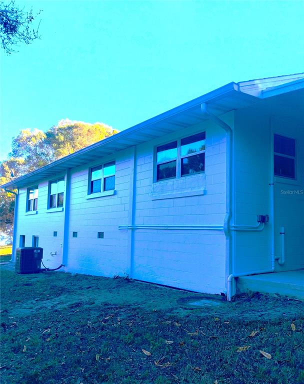 417 East Main Street Dundee, FL 33838 - Photo 6 of 24 a view of a backyard with potted plants