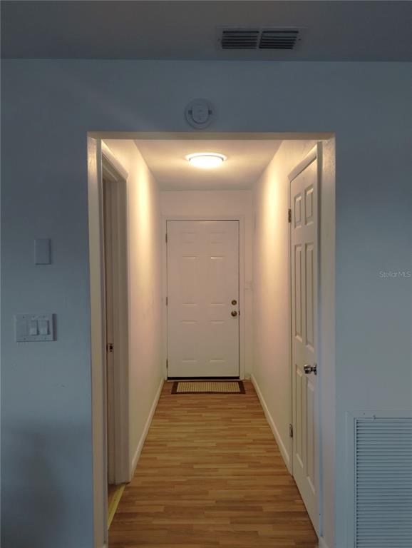417 East Main Street Dundee, FL 33838 - Photo 7 of 24 a view of a hallway with wooden floor