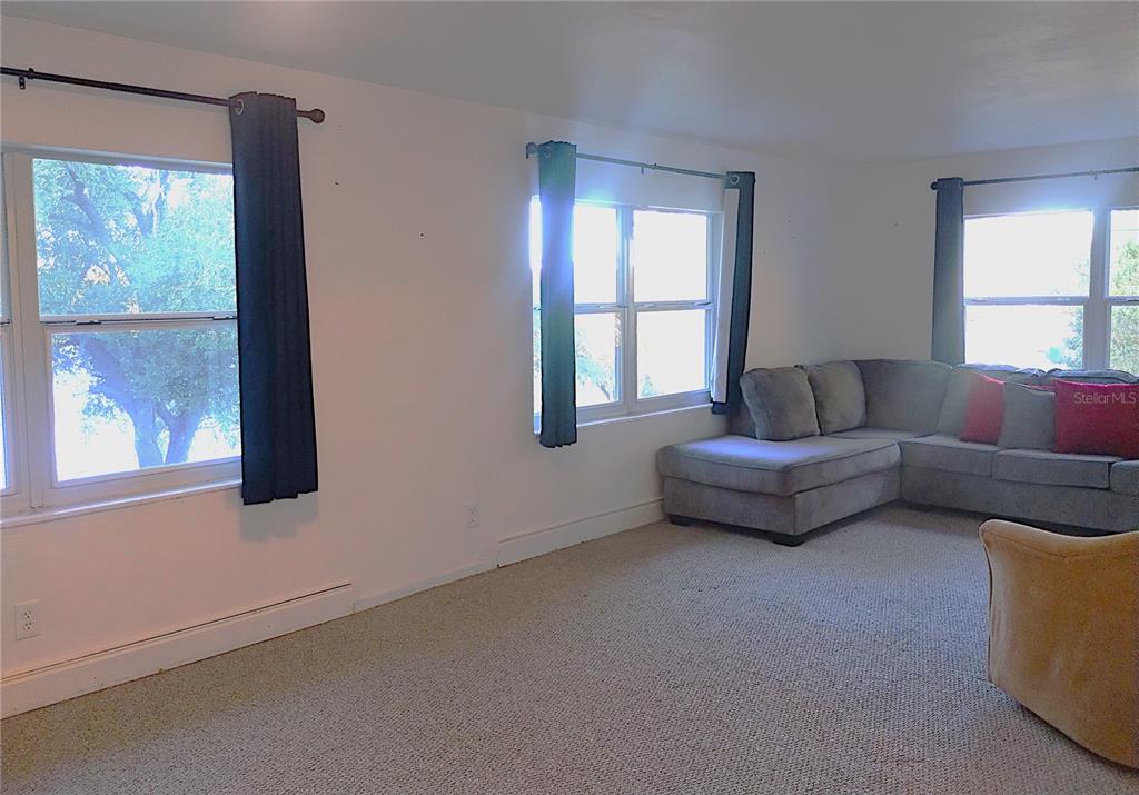 417 East Main Street Dundee, FL 33838 - Photo 9 of 24 a living room with furniture and a window
