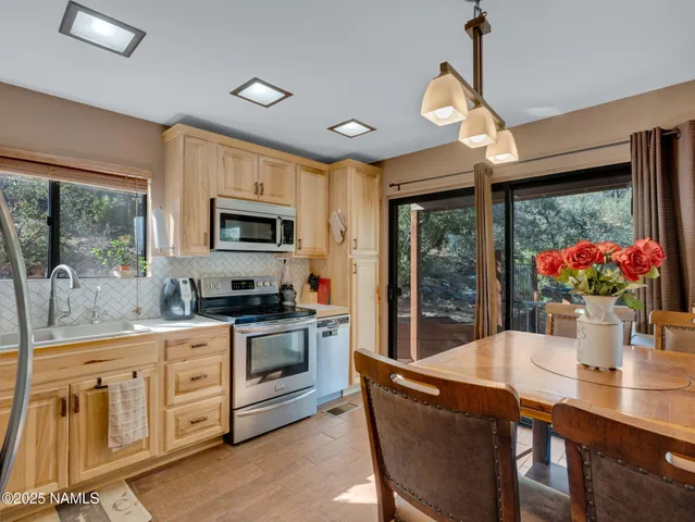 a view of a dining room with furniture window and outside view