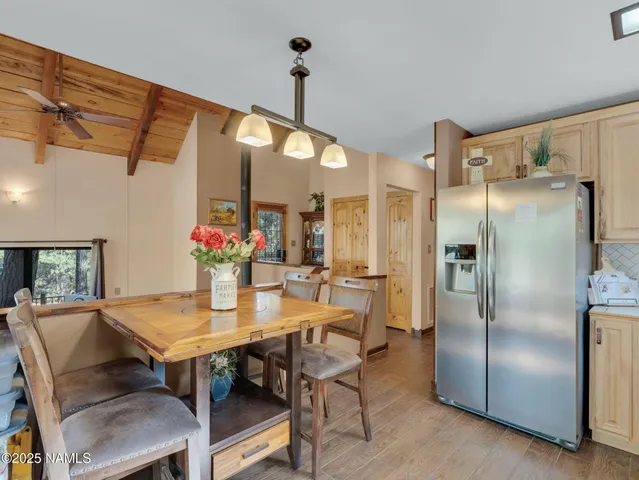 a kitchen with cabinets stainless steel appliances and a sink