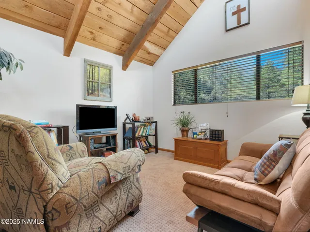 a bedroom with a bed and a potted plant