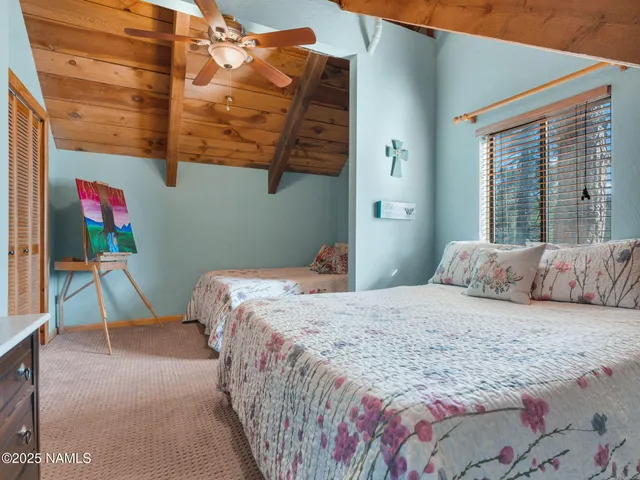 a view of a patio with a table chairs and a yard