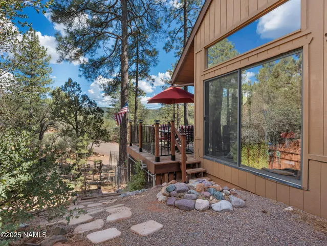 a view of balcony with wooden floor and outdoor seating