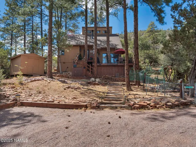 a view of a backyard of the house
