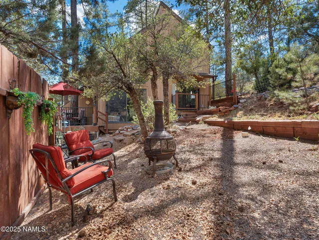 a view of a yard with large trees