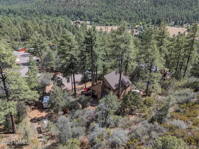 a view of a backyard of a house with a yard