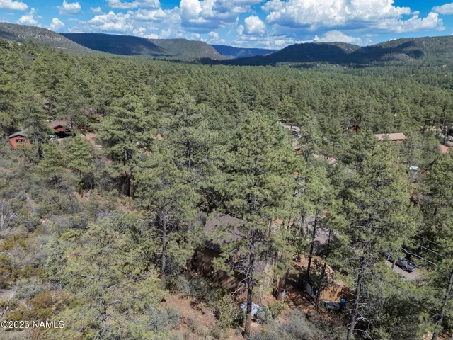 a view of a house with snow on the road