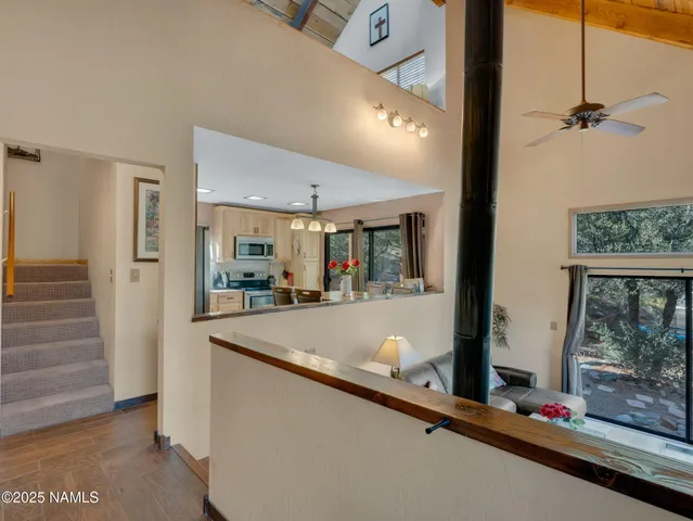 a view of living room with furniture and large window