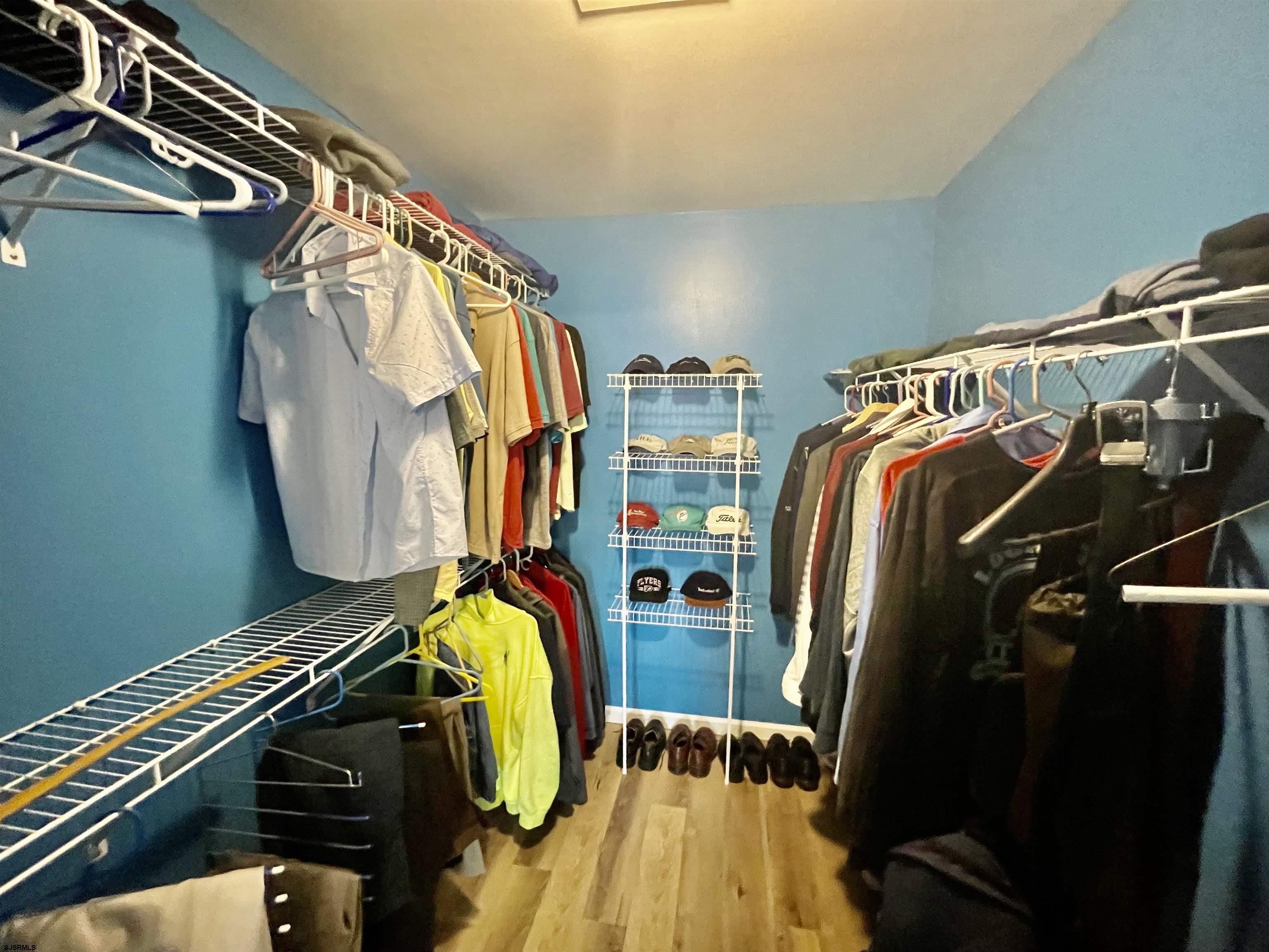 30 Cottage Road Egg Harbor Township, NJ 08234 - Photo 11 of 22 a view of walk in closet with clothes and shoes
