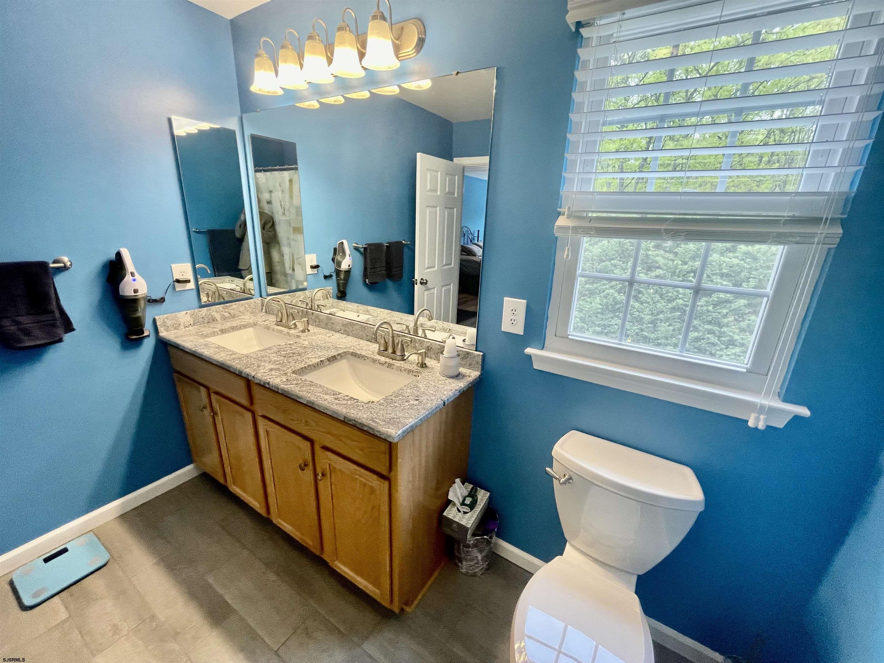 30 Cottage Road Egg Harbor Township, NJ 08234 - Photo 12 of 22 a bathroom with a sink a toilet and a mirror