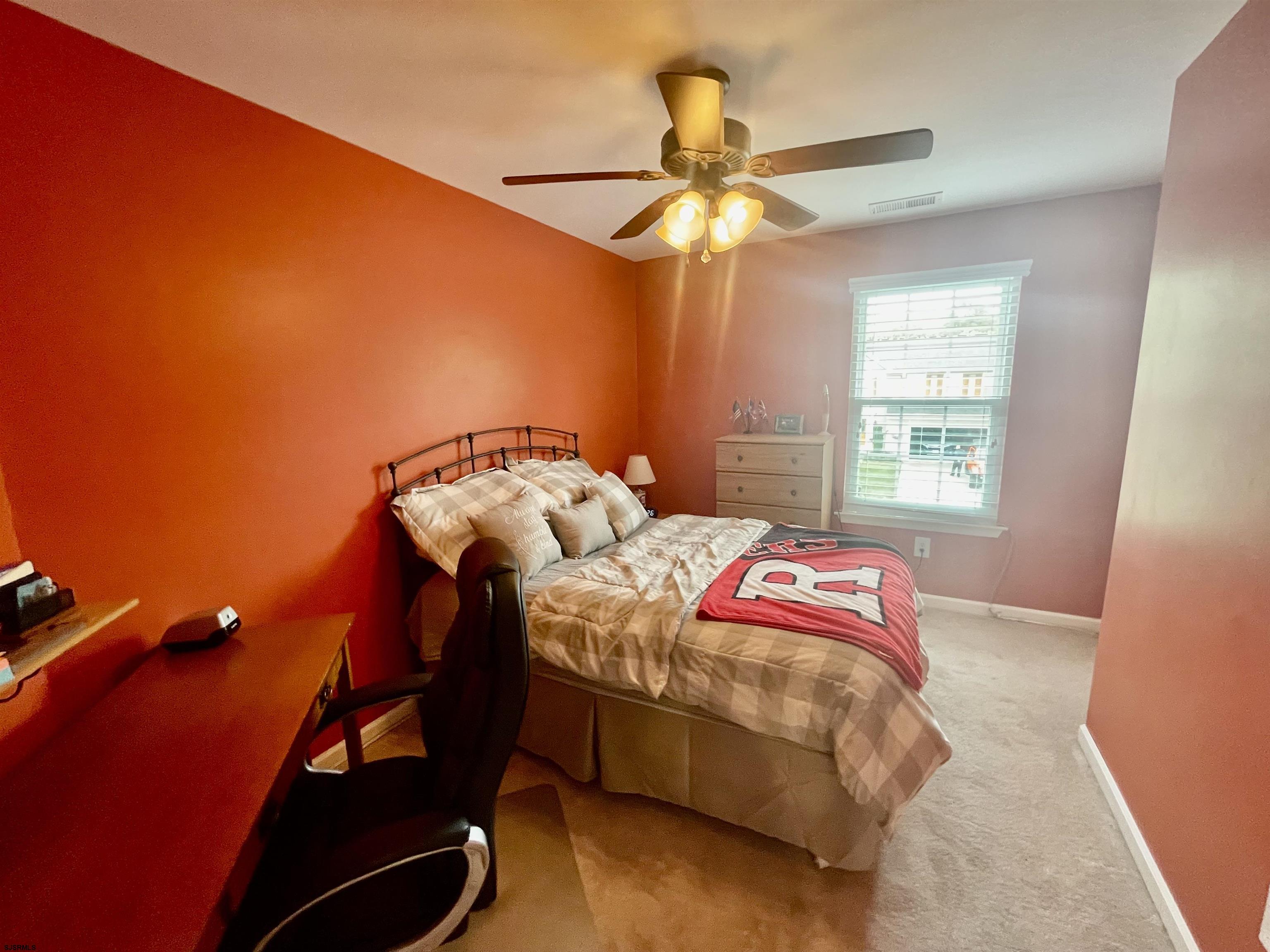 30 Cottage Road Egg Harbor Township, NJ 08234 - Photo 13 of 22 a bedroom with a bed and a chandelier