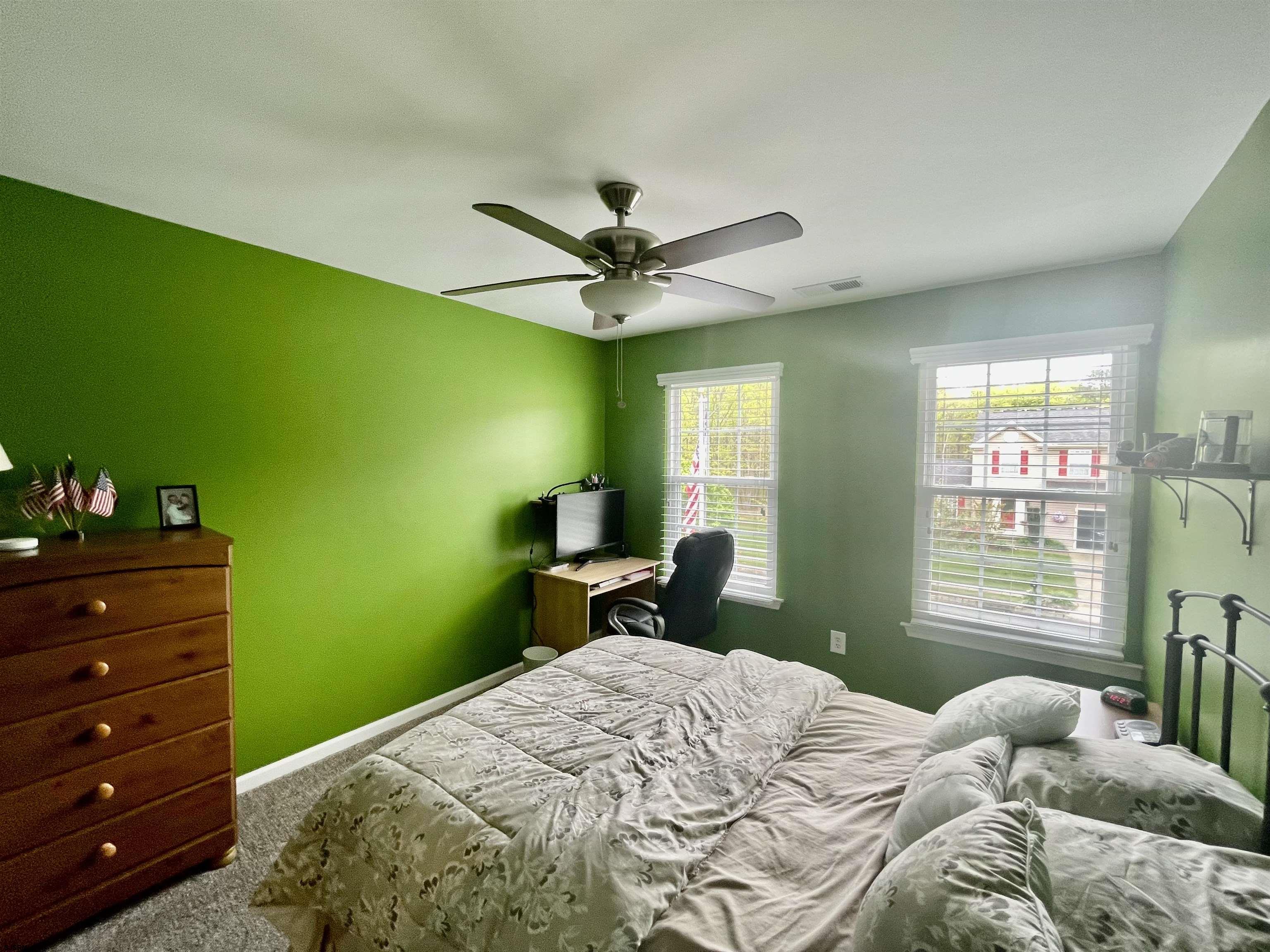 30 Cottage Road Egg Harbor Township, NJ 08234 - Photo 16 of 22 a bedroom with a bed and a dresser next to a window